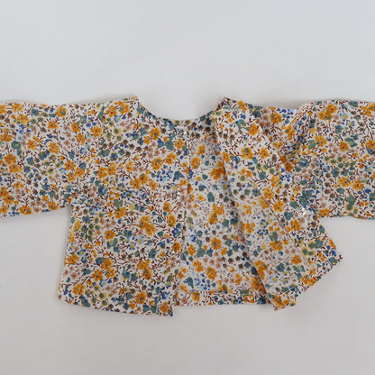 うしろはスナップボタンでとめます